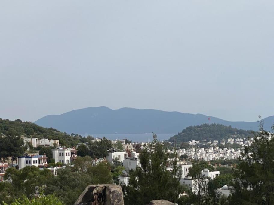 a view of a city with trees and buildings at Cheerful Bodrum Home in Bodrum City
