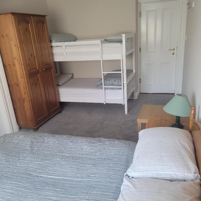 Postel nebo postele na pokoji v ubytování Dun Maeve Guesthouse