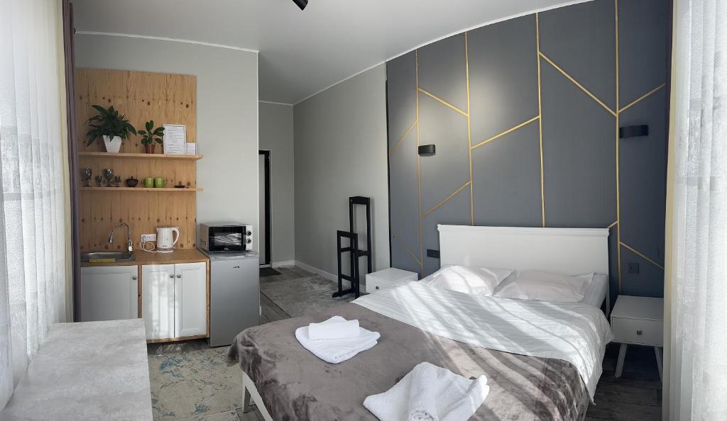 Postel nebo postele na pokoji v ubytování Vavilon