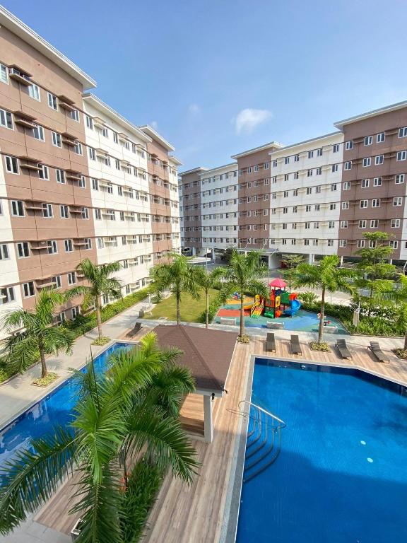 an overhead view of a resort with a swimming pool at Apparate Staycation in Hope Residences - Trece, Cavite, Philippines in Cavite