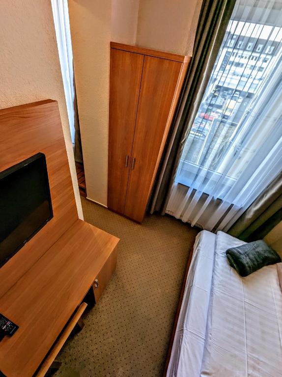 Postel nebo postele na pokoji v ubytování Hotel am Rathaus