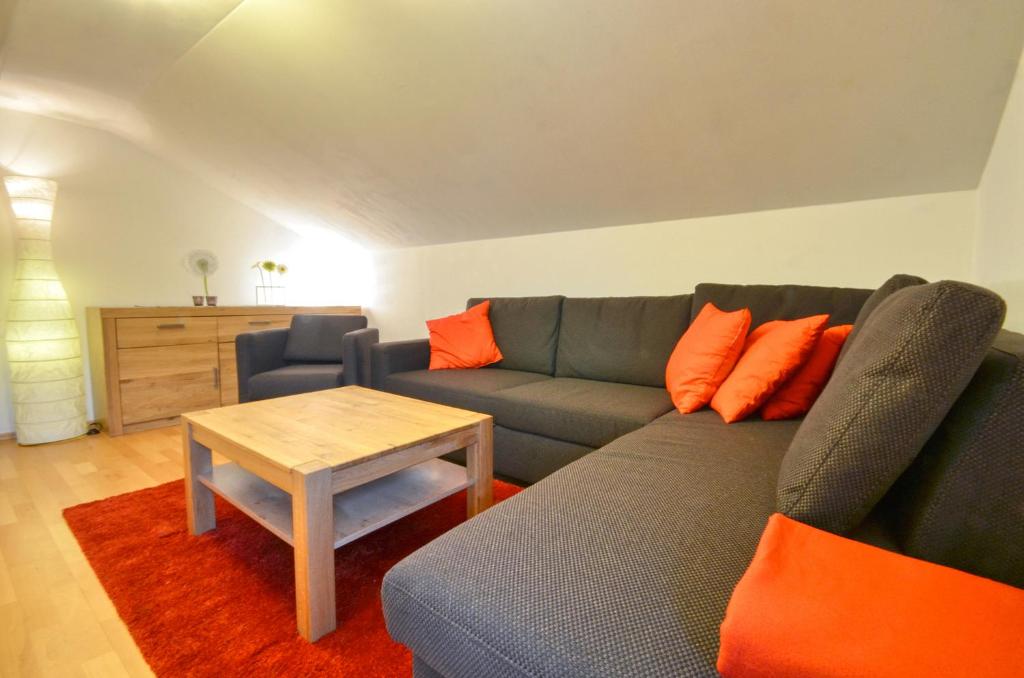 a living room with a couch and a table at Apartment Lisa - by Alpen Apartments in Zell am See