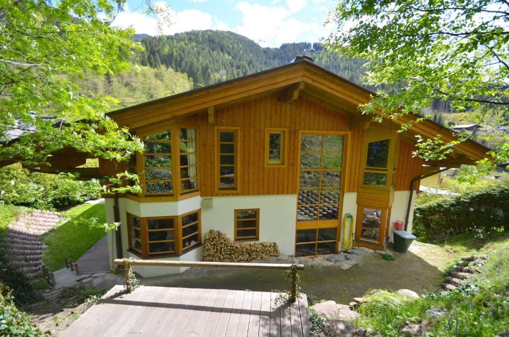 a small house with a lot of windows at Haus Thumersbach - by Alpen Apartments in Zell am See
