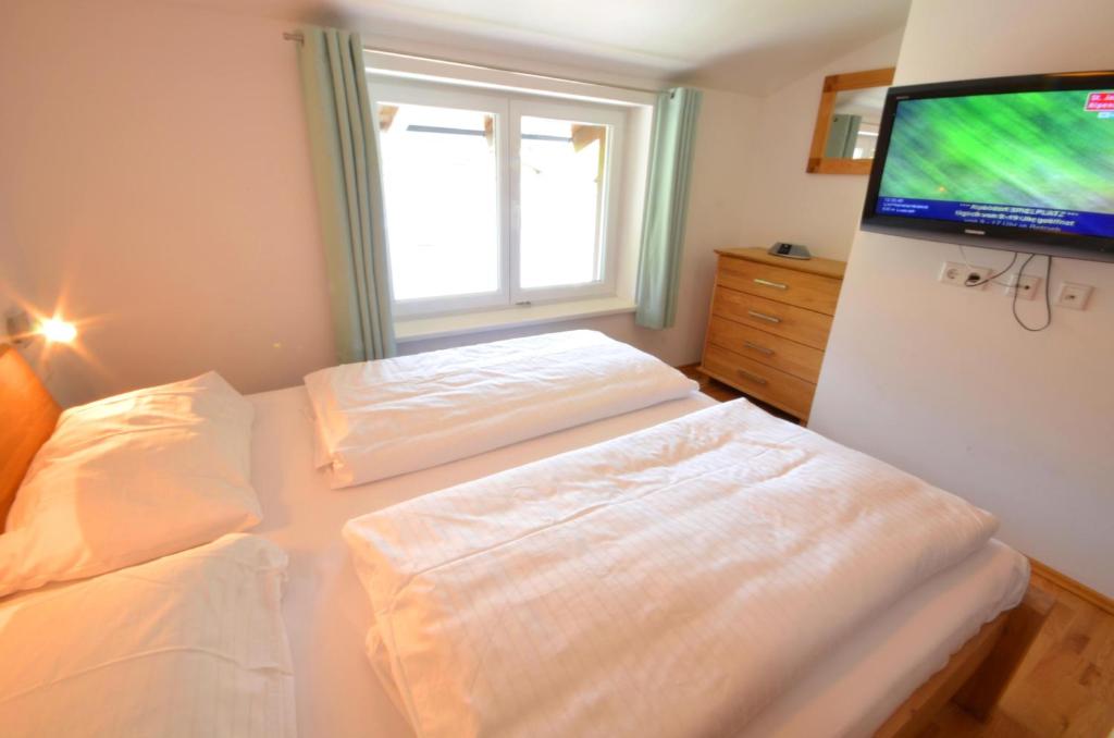 Postel nebo postele na pokoji v ubytování Penthouse Cooper - by Alpen Apartments