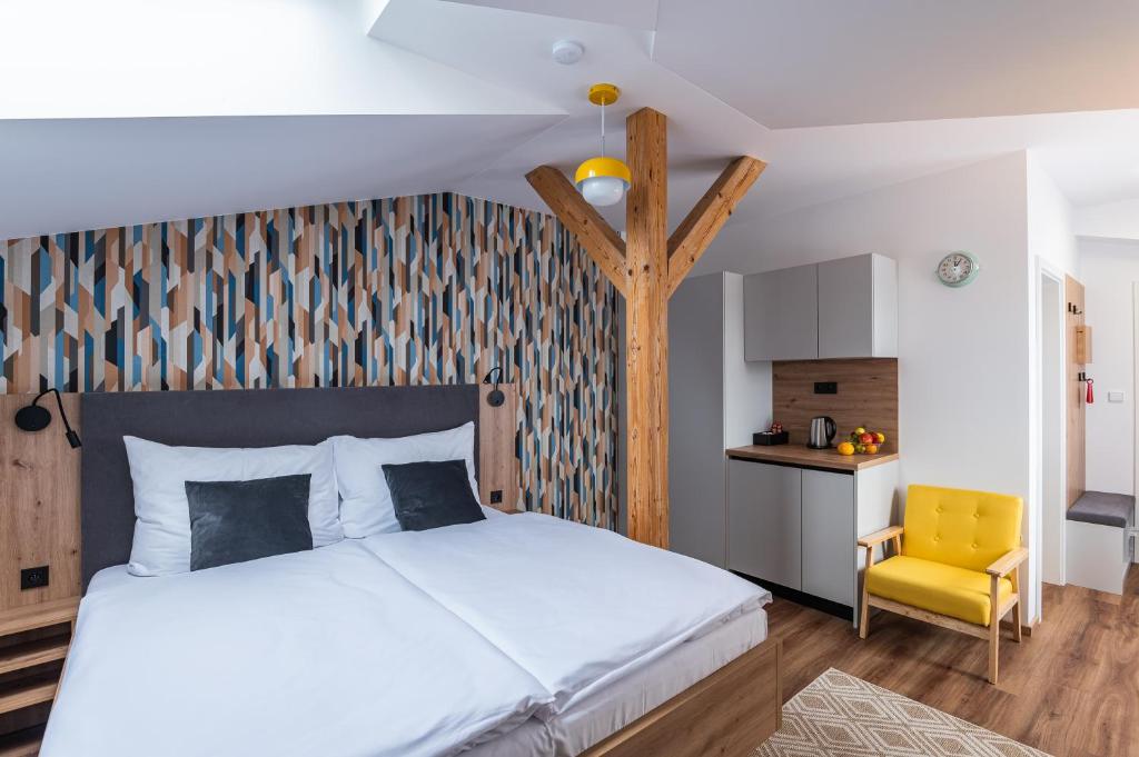 Posteľ alebo postele v izbe v ubytovaní Hotel Restovna