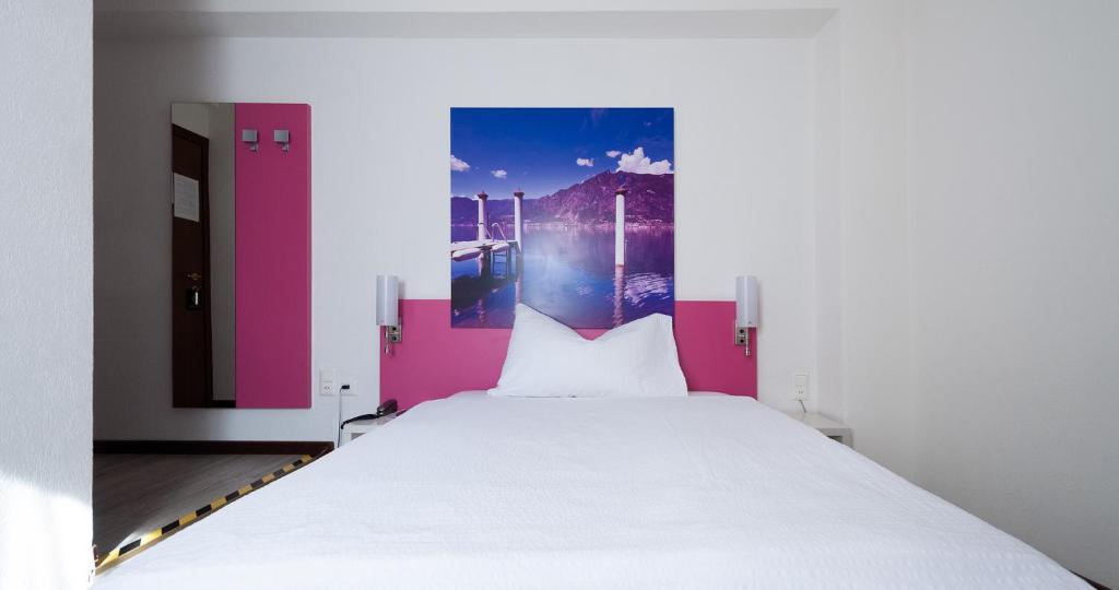 Letto o letti in una camera di Acquarello Swiss Quality Hotel