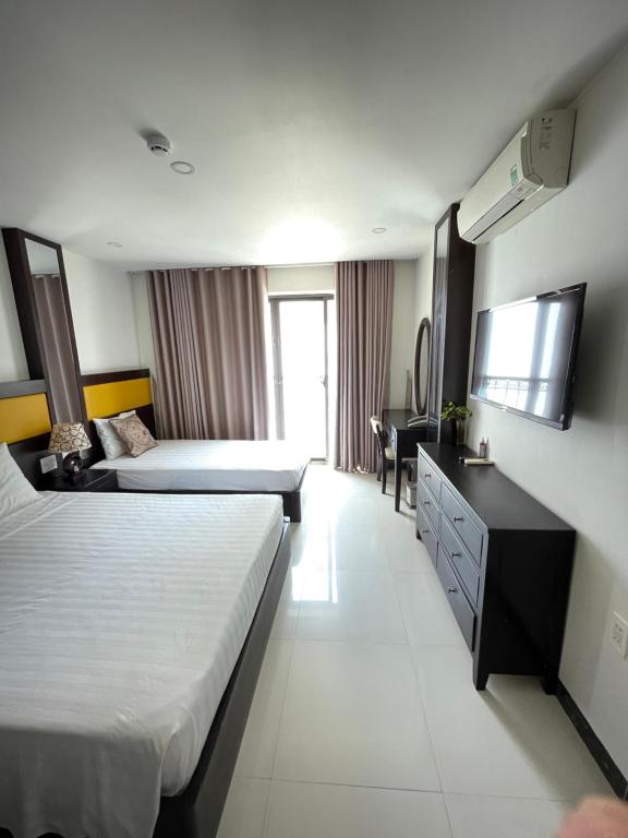 Giường trong phòng chung tại Tokia hotel nha trang