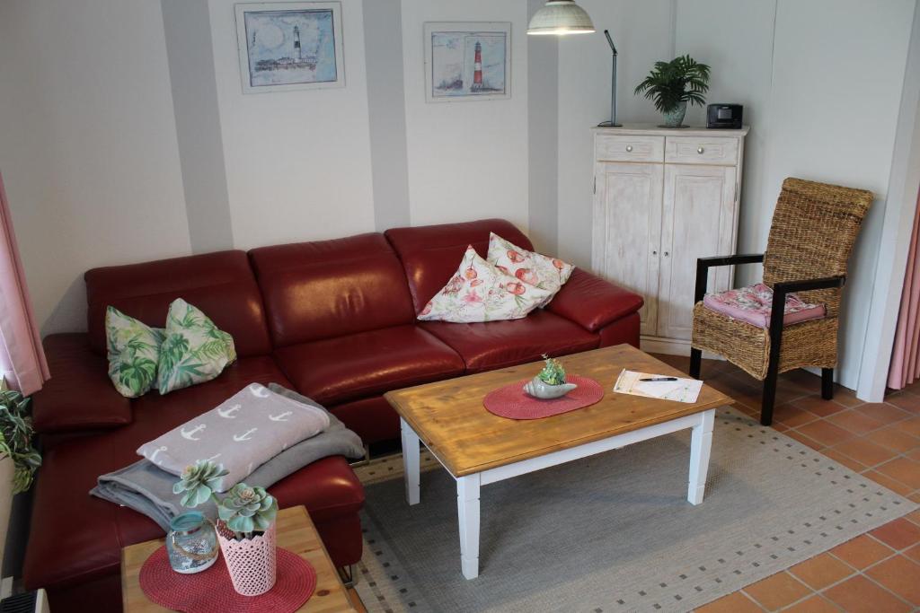 a living room with a couch and a coffee table at Huus Diekkieker in Nordstrand