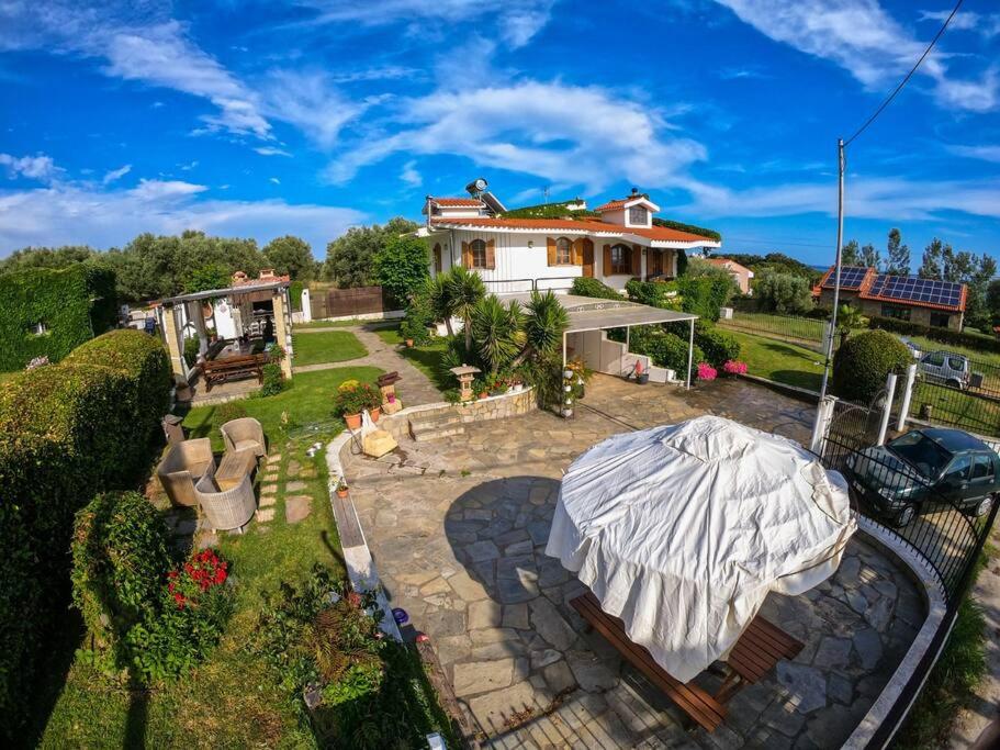 an aerial view of a house with a large umbrella at Casa Martina in Alexandroupoli