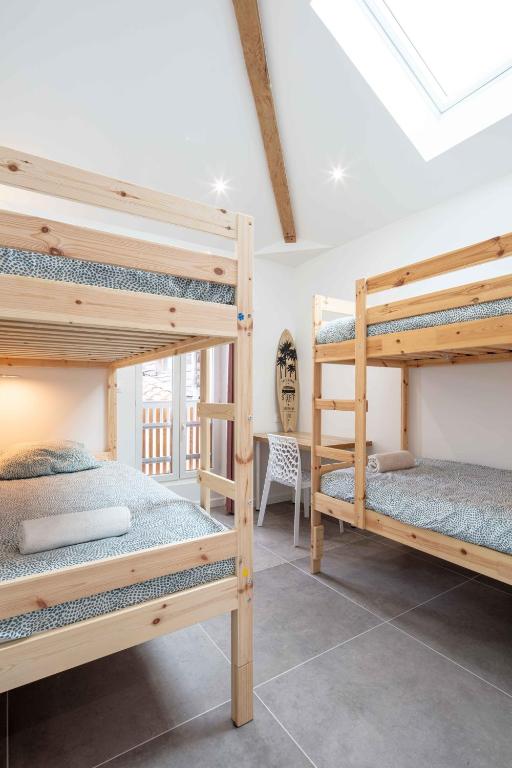 Postel nebo postele na pokoji v ubytování Ted Surf House