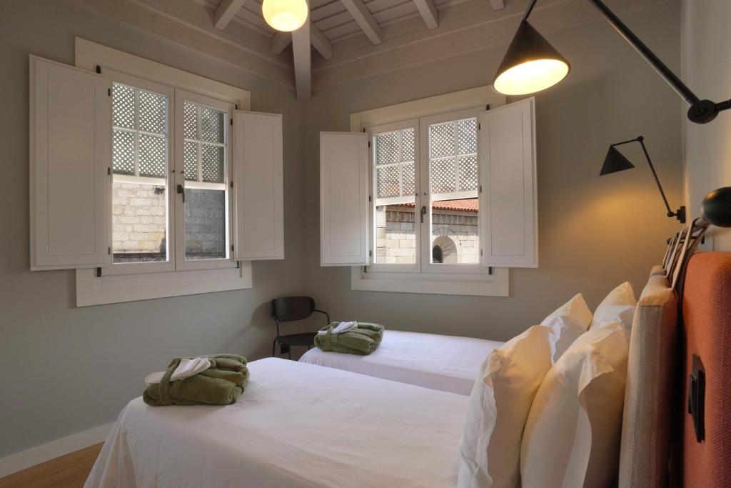 Postel nebo postele na pokoji v ubytování Hotel da Oliveira