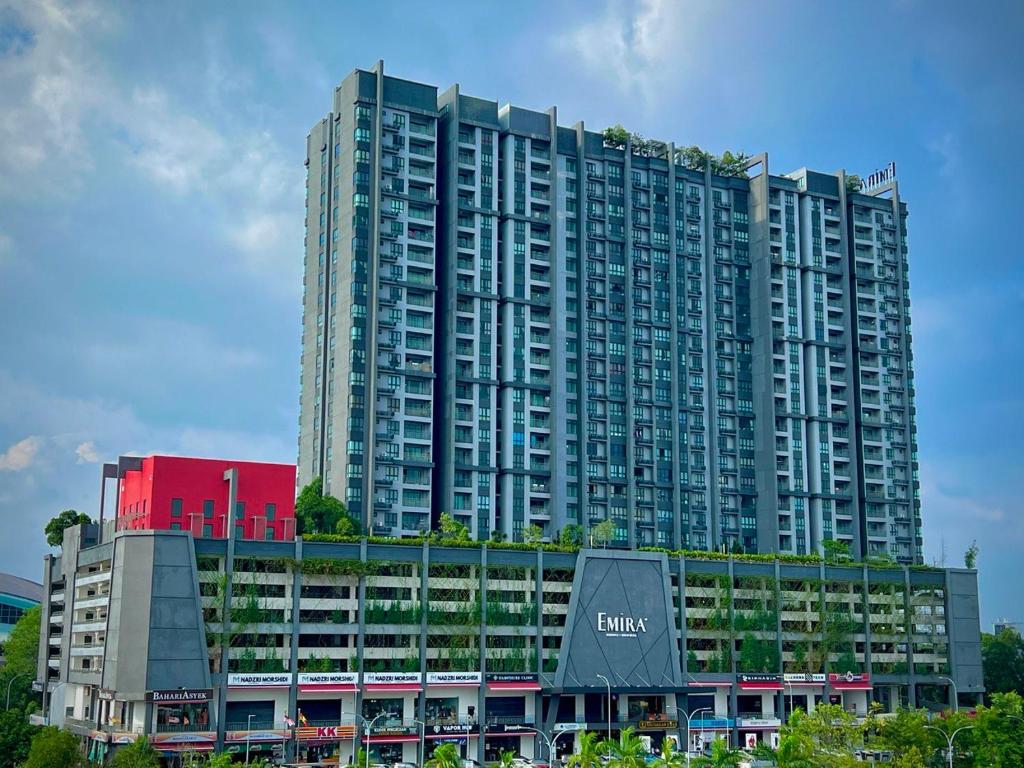 a large apartment building with a sign on it at Alpha LaVista at Emira Residence Shah Alam in Shah Alam