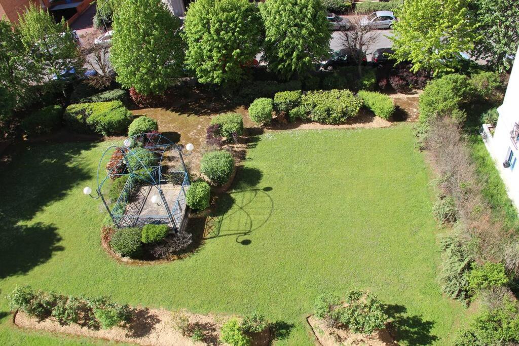 an aerial view of a garden with a playground at APPARTEMENT COSY Balcon à 30min de PARIS in Cergy