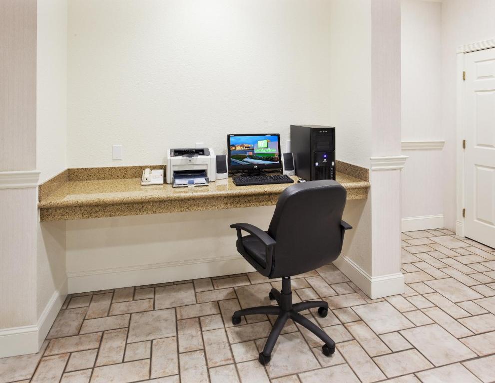 a desk with a laptop computer and a printer at Holiday Inn Redding, an IHG Hotel in Redding