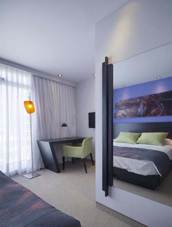 Ambit Boulevard Hotel Boutiqueにあるベッド