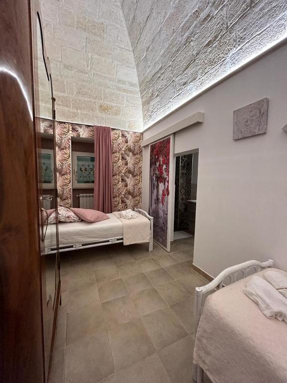 Postel nebo postele na pokoji v ubytování B&B LE CUSPIDI