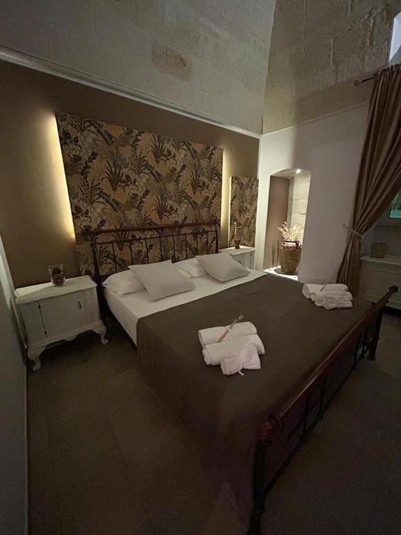 Postel nebo postele na pokoji v ubytování B&B LE CUSPIDI