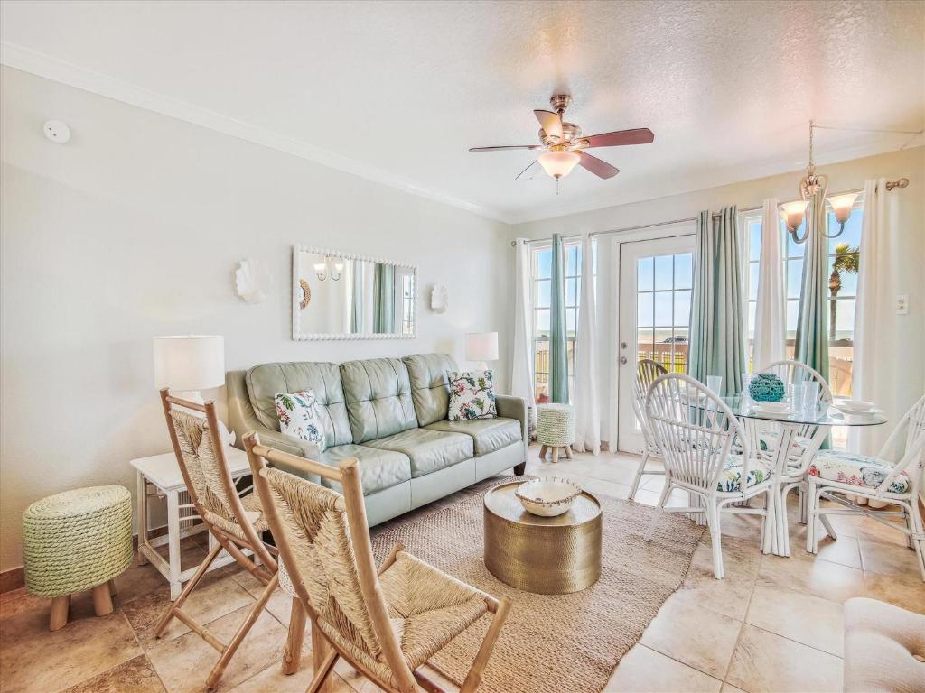 a living room with a couch and a table at Victorian 8104-Gulf Dreams in Galveston