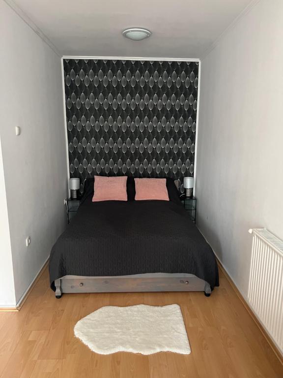 Postel nebo postele na pokoji v ubytování Belvárosi apartman
