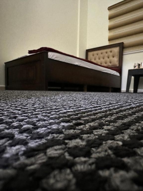 a bed in a room next to a desk at Hustle's look in Wadi Musa