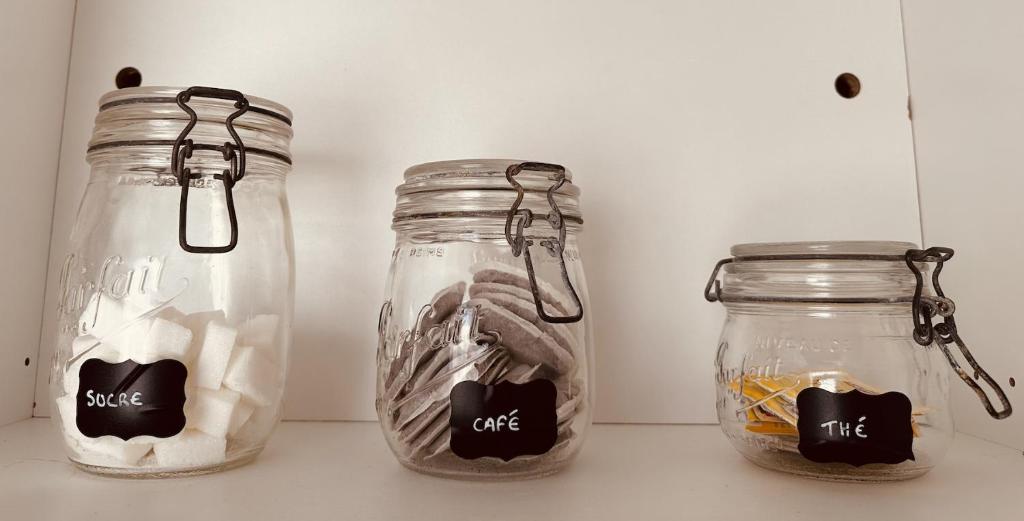 two mason jars sitting on top of a counter at Studio 1 du SPA Célinie in Warcq