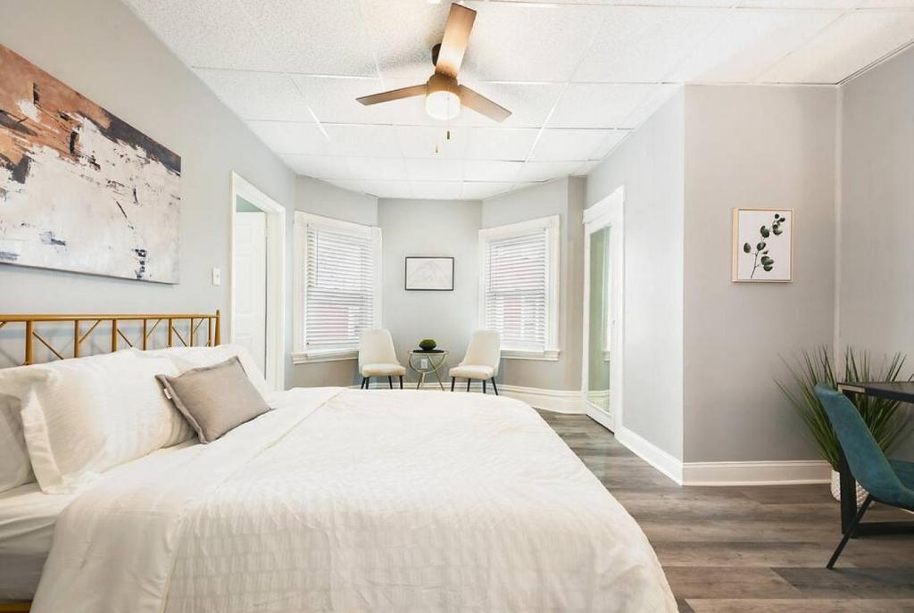 a bedroom with a bed and a ceiling fan at Beauty Sleep on Bellevue 