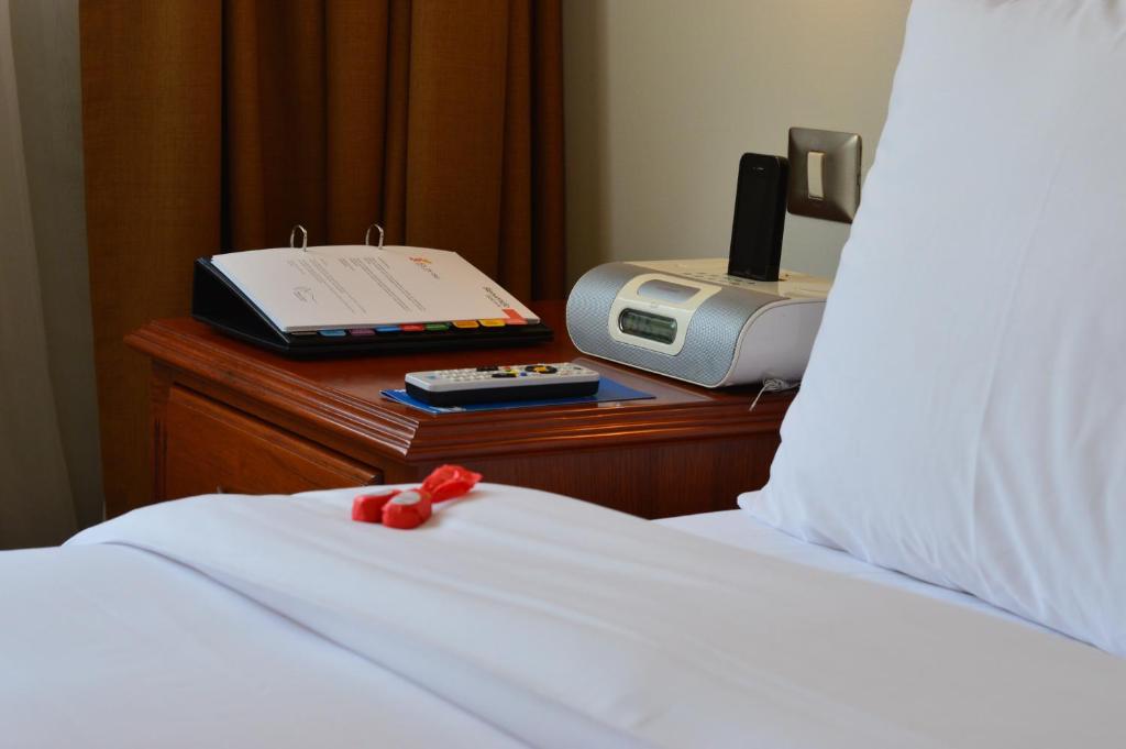 Postel nebo postele na pokoji v ubytování Sol de Oro Hotel & Suites