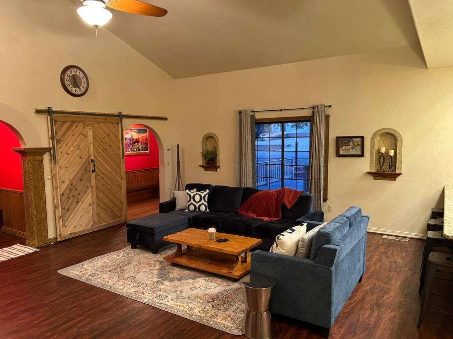 a living room with a couch and a table at Family Friendly Home with Character and Charm in Sedona
