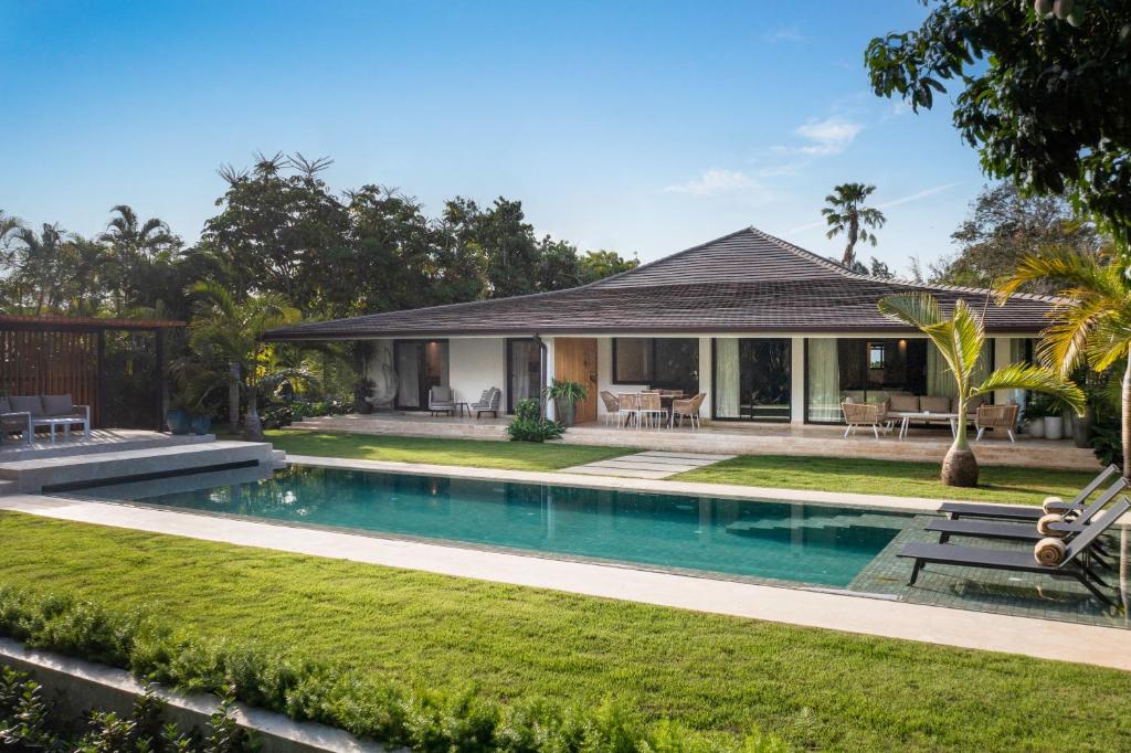 an image of a house with a swimming pool at Villa Mar y Lago, Casa de Campo in La Romana