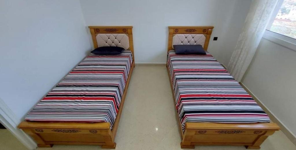 Postel nebo postele na pokoji v ubytování Al Hoceima Ajdir Maroc - Maison 5 chambres 12 personnes