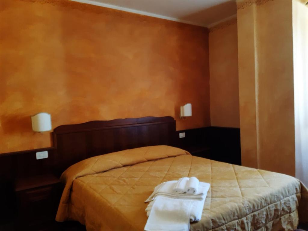 Postel nebo postele na pokoji v ubytování Hotel Natros