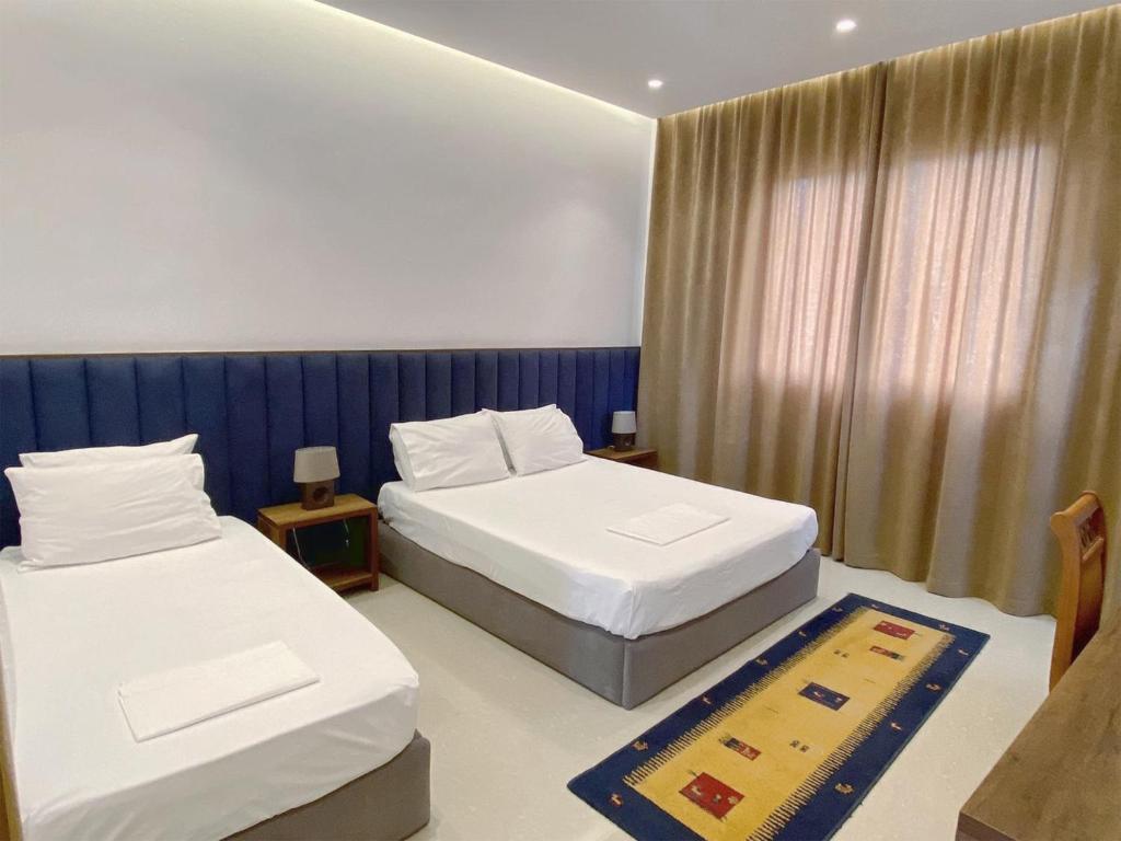 Postel nebo postele na pokoji v ubytování Guesthouse Niko