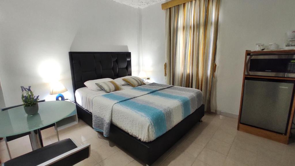 Voodi või voodid majutusasutuse BELLA SUITE frente al Aeropuerto toas