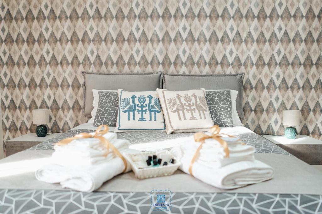 A bed or beds in a room at DOMUS 73 Apulian holidays