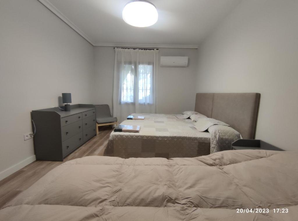 Postel nebo postele na pokoji v ubytování Los Cipreses