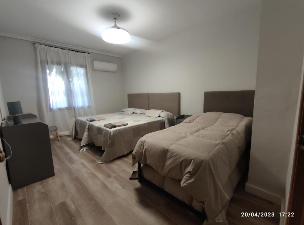 Postel nebo postele na pokoji v ubytování Los Cipreses