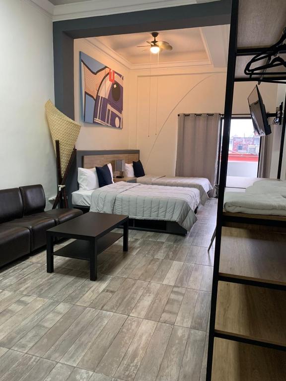 Postel nebo postele na pokoji v ubytování Hostal 170