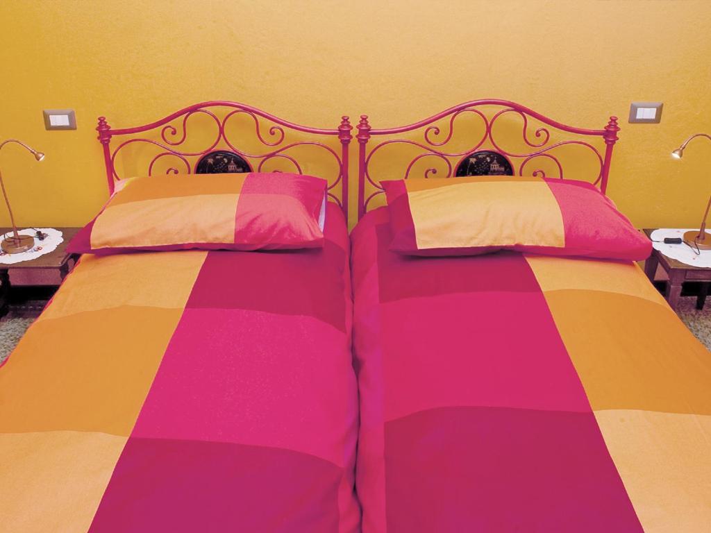 Posteľ alebo postele v izbe v ubytovaní Le Coccinelle B&B