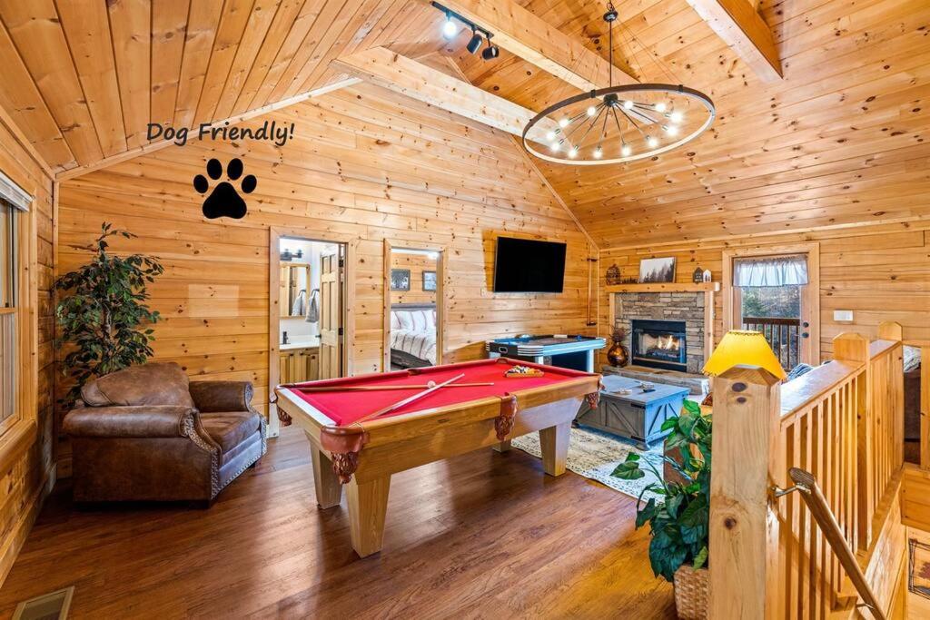 a living room with a pool table in a cabin at The Sly Fox - Recently Updated/ Ideal PF Location in Pigeon Forge