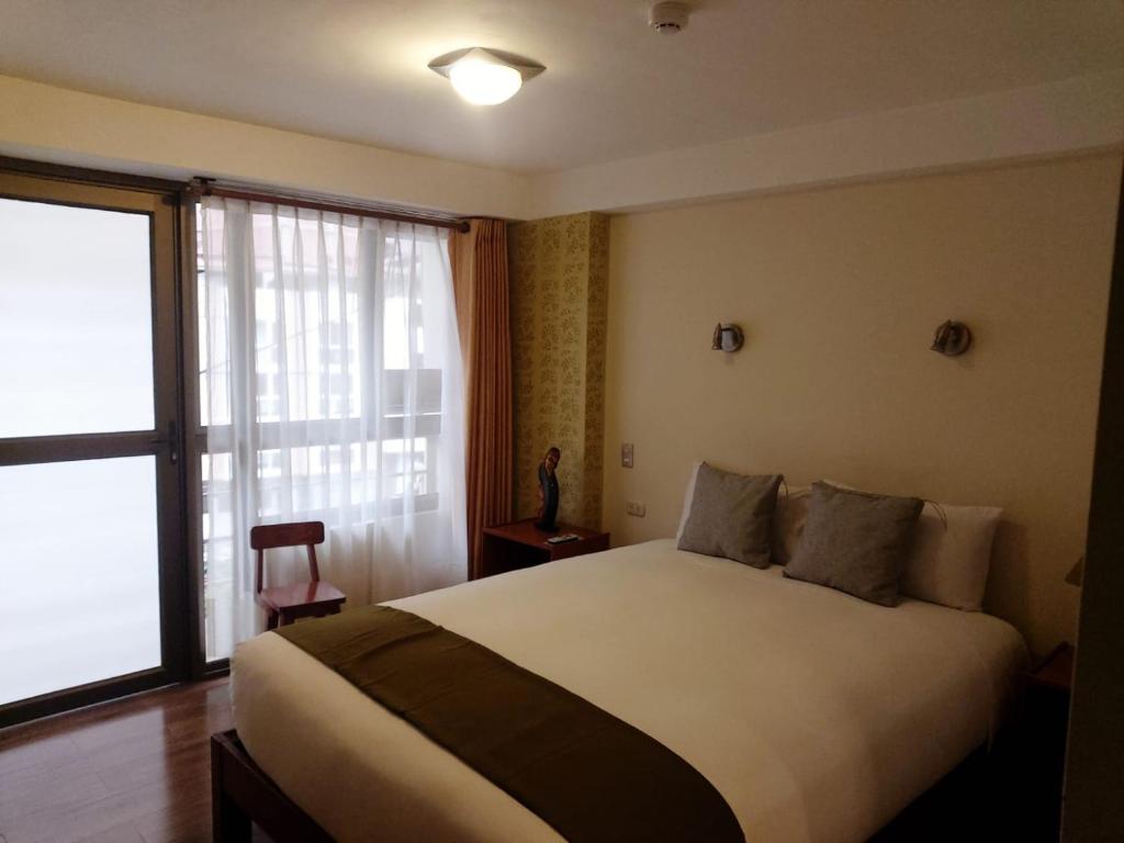 Postel nebo postele na pokoji v ubytování Hotel Pucara Machupicchu