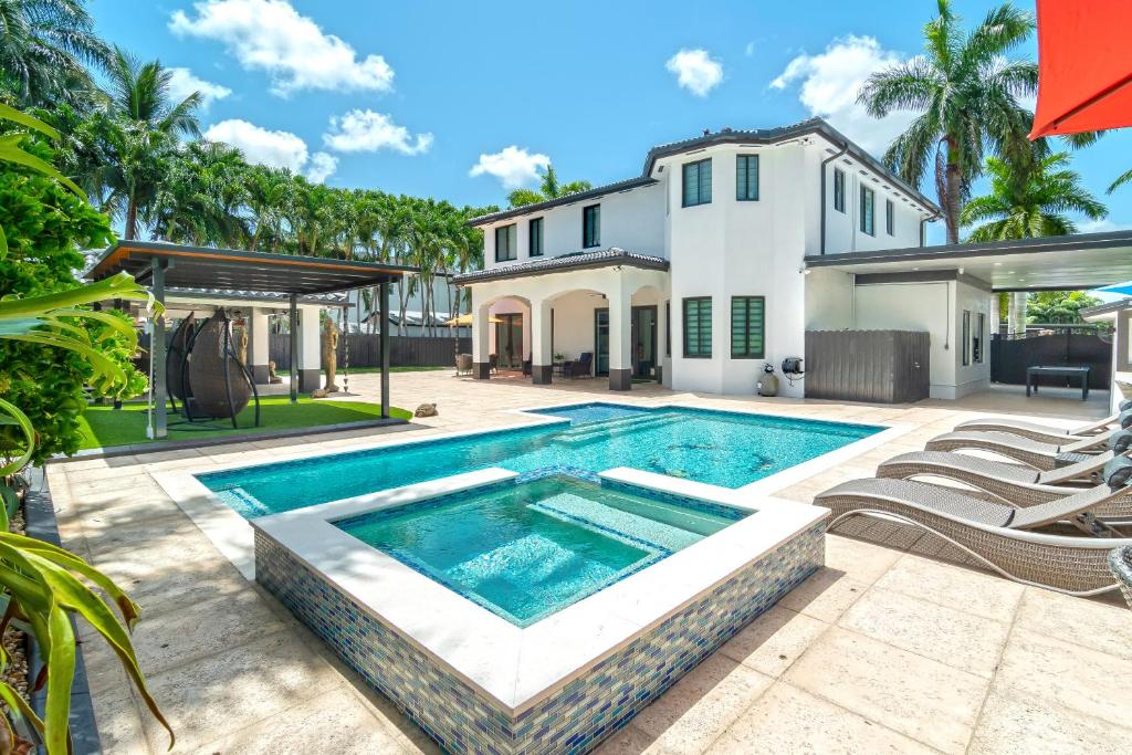 a swimming pool in the backyard of a house at The tropical paradise villa in Miami