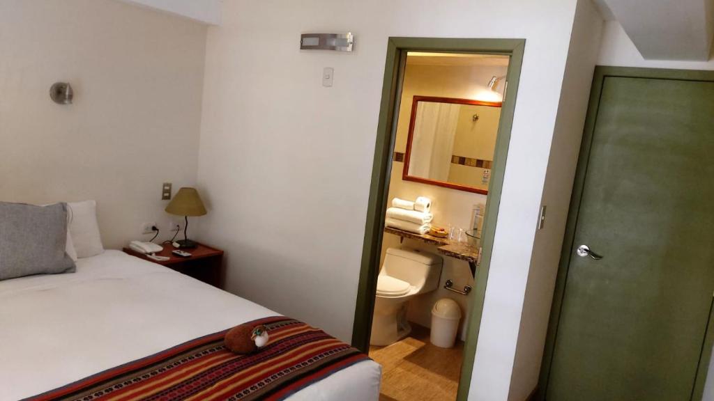 Postel nebo postele na pokoji v ubytování Hotel Pucara Machupicchu