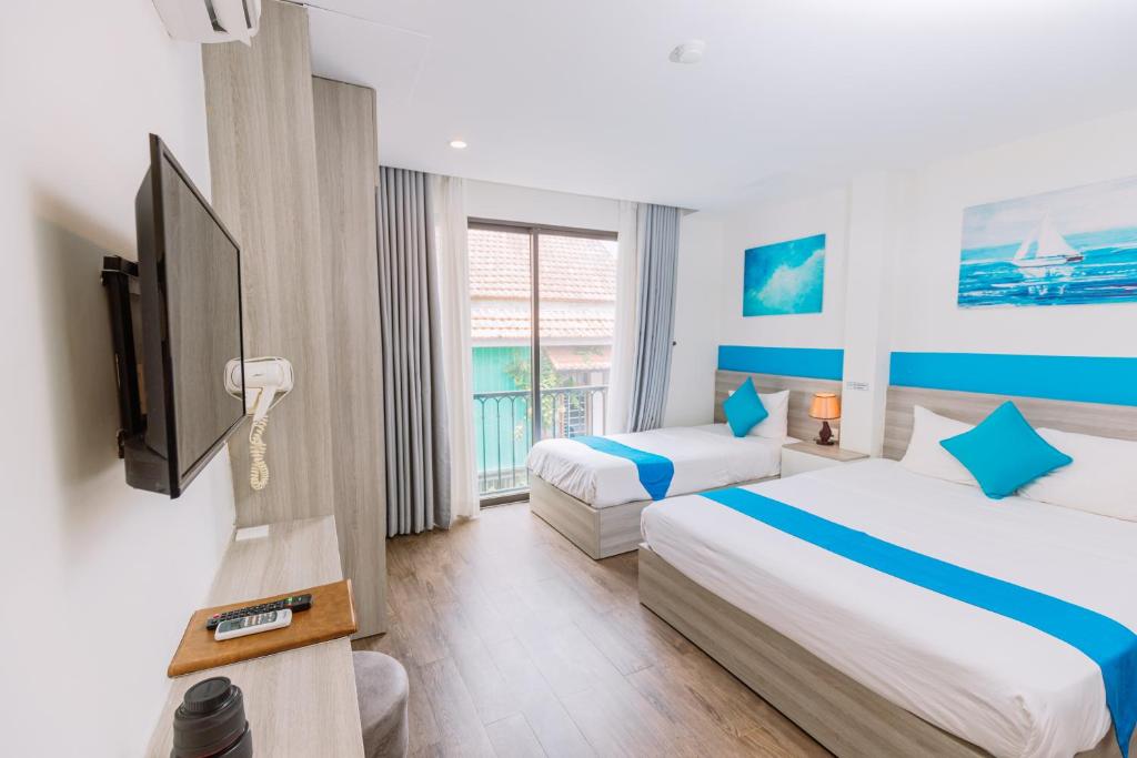 Giường trong phòng chung tại TÒ VÒ Hostel 2 - Huế