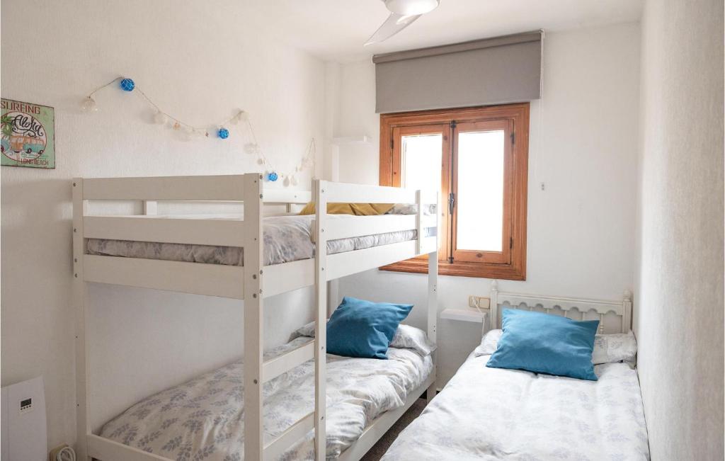 A bed or beds in a room at Nice Apartment In La Manga With Wifi