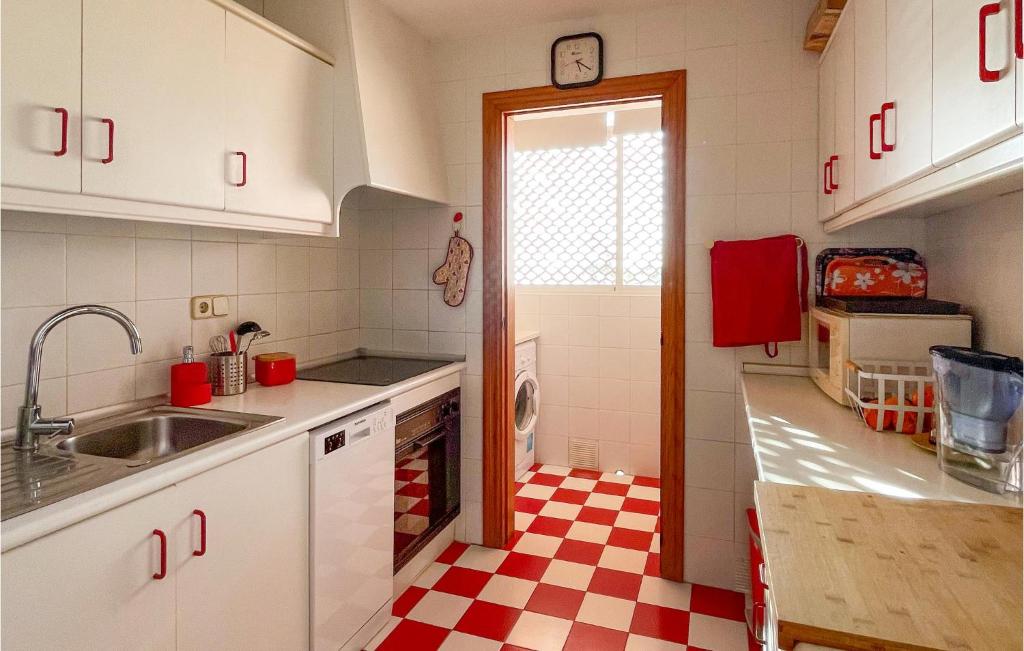 A kitchen or kitchenette at Nice Apartment In La Manga With Wifi