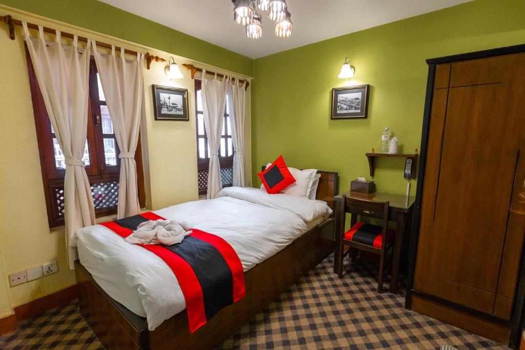 Postel nebo postele na pokoji v ubytování Vajra Boutique Hotel