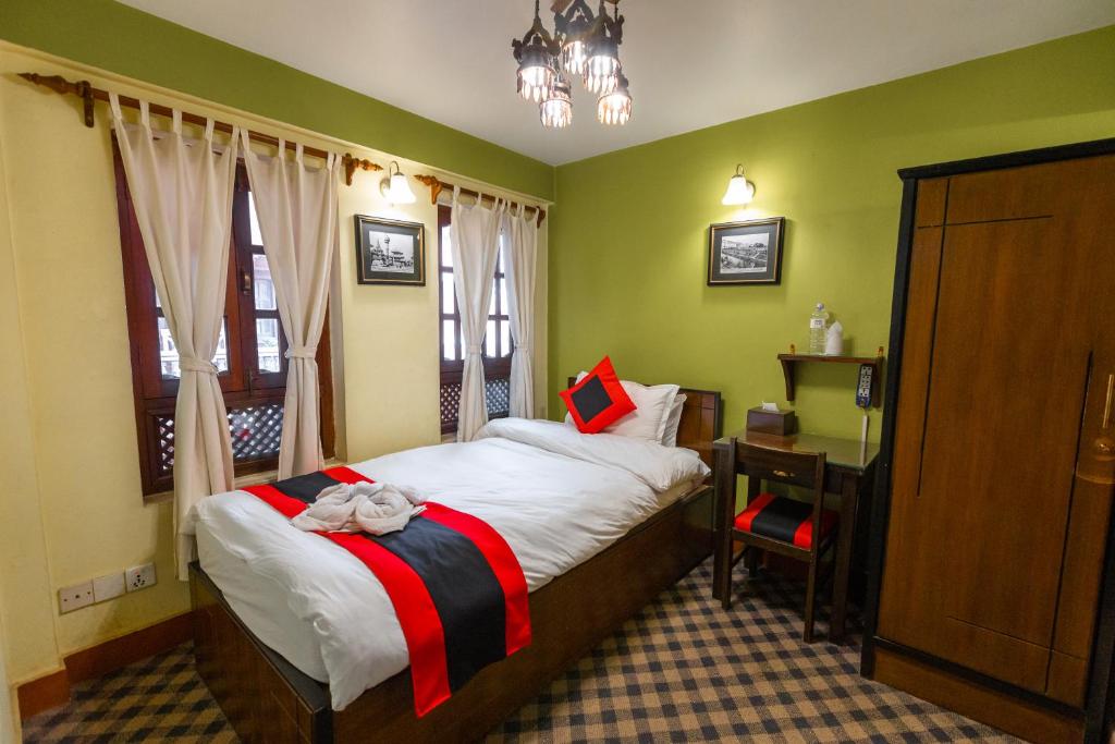 Postel nebo postele na pokoji v ubytování Vajra Boutique Hotel