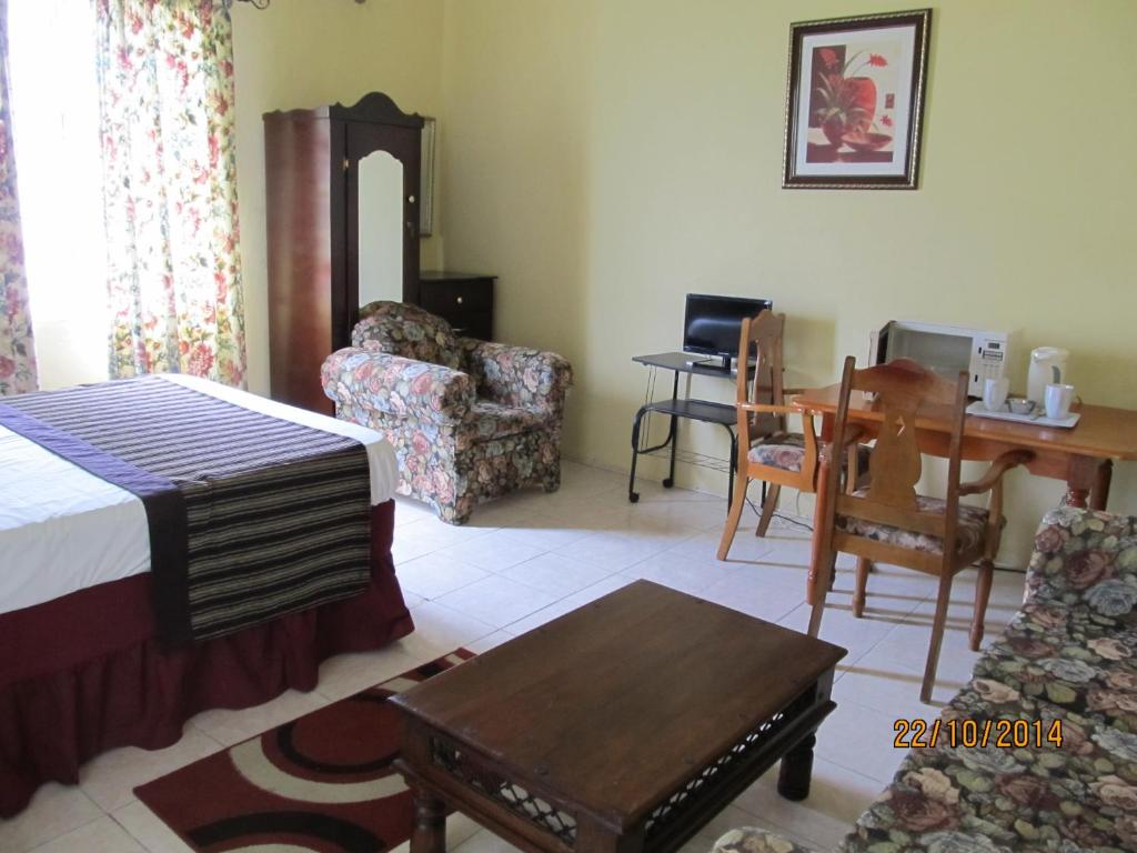 Postel nebo postele na pokoji v ubytování Barefoot Guest House