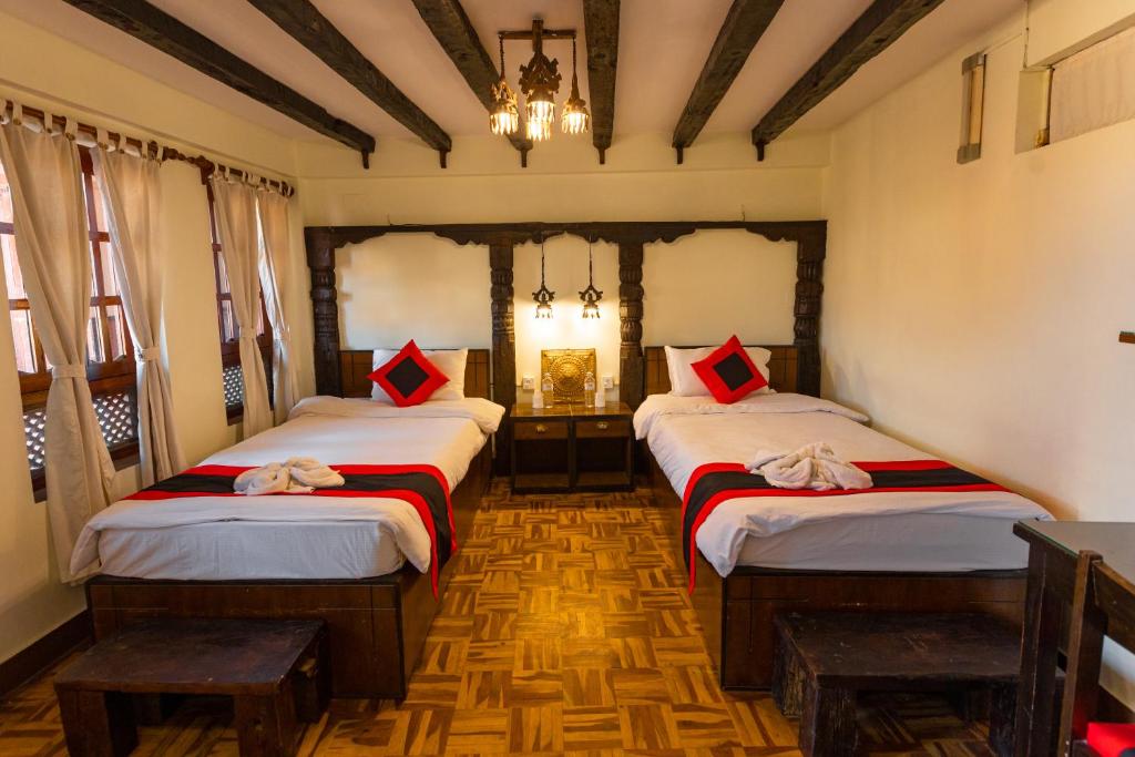 Postel nebo postele na pokoji v ubytování Vajra Boutique Hotel