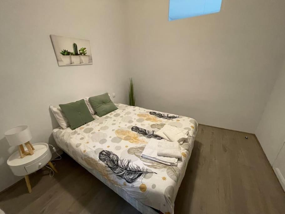 Ein Bett oder Betten in einem Zimmer der Unterkunft Cosy T3 proche Gare et Polygone